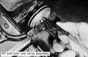 (See Fig. 11.) Discard old snap ring. Remove servo from vise carefully and separate halves. FIGURE 10 Assemble servo and place in vise to compress spring.