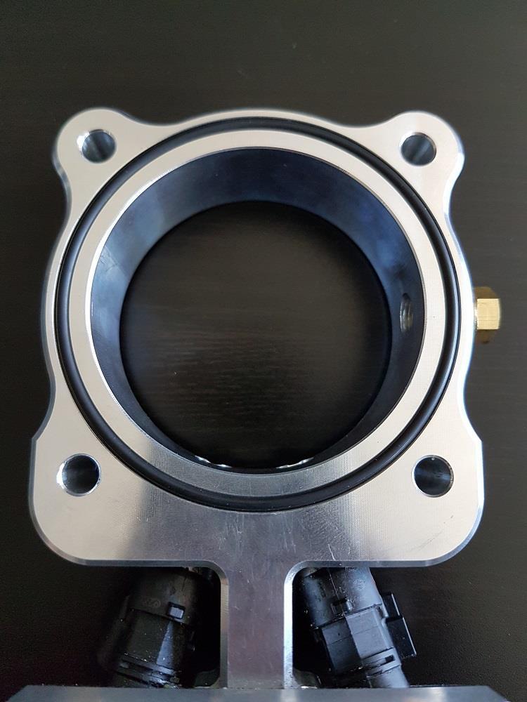 Place the included O-ring into the groove of the Stratified throttle body spacer. 15.