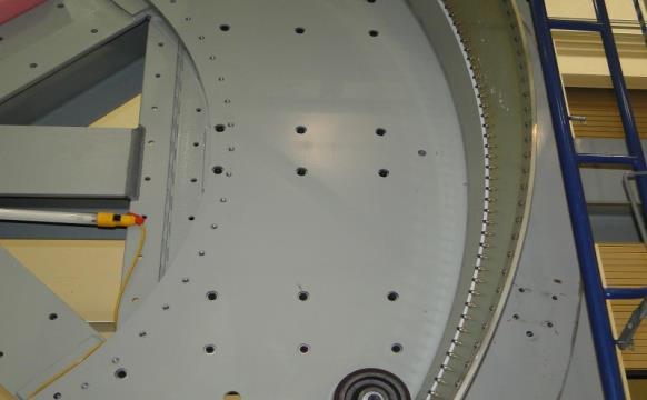 Figure 4: Pre-existing holes (left) and mounting plate (right) 6.