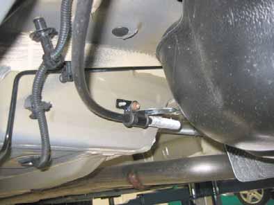 Mount the fuel line and wiring harness with rub protection on sharp edges. WARNING! The fuel line and wiring harness are routed to the metering pump as shown in the wiring harness routing diagram.