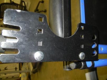 Figure 2: Folded and unfolded positions Next, set the backrest into place by putting the pins sticking out of the backrest into the bracket shown in Figure 3 below.