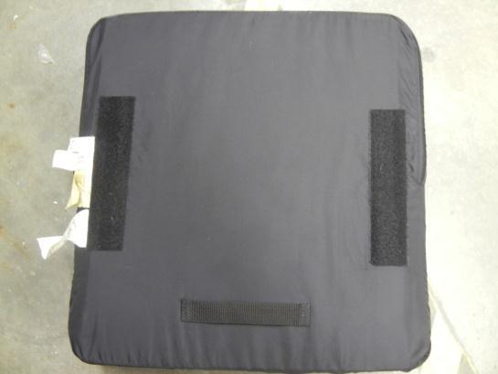 The part of the seat cushion with the large lump in the center should be facing closest to the front of the wheelchair.