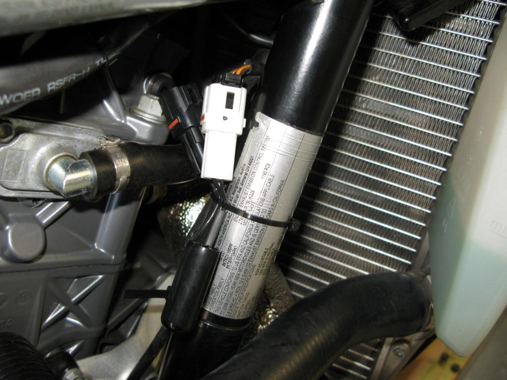 Now that the installation of the fuel harness is complete, route the Bazzaz coil harness in front of the air box (similar to that of the Bazzaz fuel