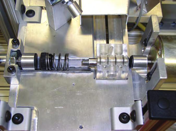 13. Manually place the valve body assembly in the recess provided on the work surface, as shown in figure 93.