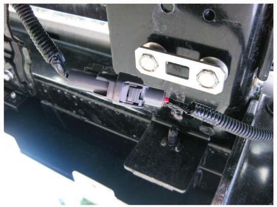 2013 Isuzu Truck 16.31 7) Remove protective cover, and plug chassis side power supply harness into electronic trailer brake controller power supply connector (Wire #1).