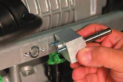 Install the small vacuum hose from the nipple on the fuel regulator to the