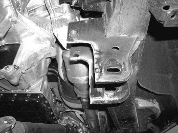 Using the supplied 9/16 x 4 ½ bolts, nuts, and washer attach the crossmember to the factory front lower control arm pockets. Leave loose at this time. 19.