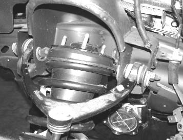 Position the shim in between the new mount and the control arm.