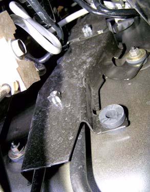 10. Remove two nuts and brake line bracket from lower driver side firewall. Brake Lines e. Remove four bolts and boot ring from floor. Nuts Driver Side Firewall Inside of Vehicle 1.