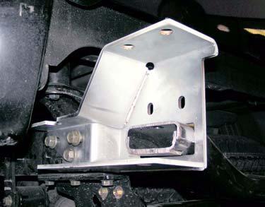 c. Install two kit brackets (rear bumper) onto frame rails with six bolts.