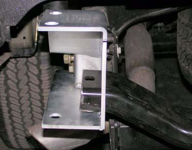 Install two kit brackets (rear bumper, support) onto bumper crossmember with four kit bolts (1/ 2