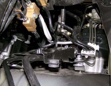 c. Install brake line bracket onto two kit brackets with two kit washers (1/4 SAE) and two kit nuts (1/4 Nylock).