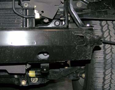 Remove two bolts and two side supports from driver and