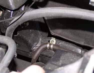 7. Remove bolt, power steering cooler line, and bracket from driver side frame rail. Driver Side Frame c.