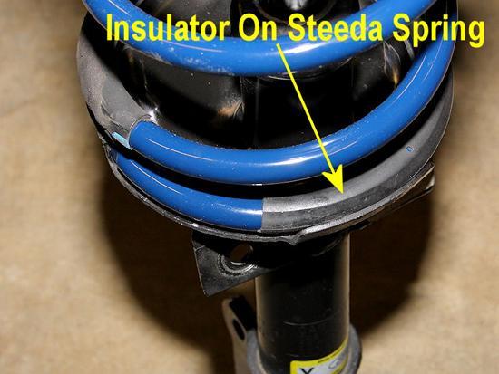 18. Install the insulator on the new Steeda spring. 19.