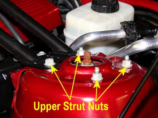 Raise the hood, and remove the nuts shown below with a 13mm socket and socket wrench. Be careful when removing the last nut.