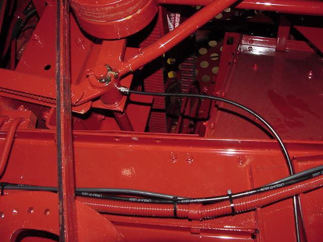 Install one # 244055 Fitting, replacing grease zerk for Straw Chopper Idler Arm.