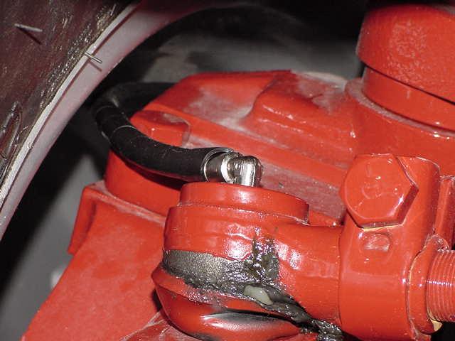 Install one 244054 fitting, replacing grease zerk from Steering Cylinder Ball Joint