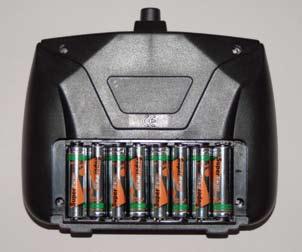 1) Remove the battery compartment cover located on the back of the transmitter by sliding it down. 2) Insert 8 AA 1.5 Volt Alkaline batteries.