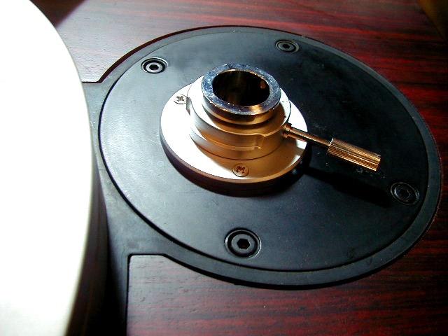 Temporarily place the tonearm into to this hole.