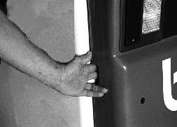 REAR DOOR Opening And Closing AVOID INJURY OR DEATH Never service or adjust the machine when the