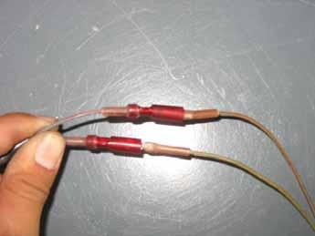 The two wires with red stripes should be connected.