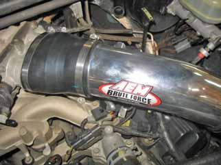 Secure the supplied hose to the valve cover nipple using the