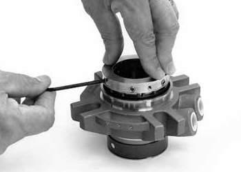 4 5 Carefully lift the lock ring and rotary assembly out holding the rotary seal ring as well as the
