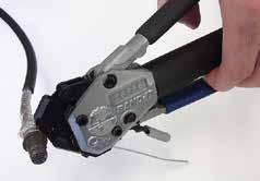 (This indicates the band is compressed to the tool precalibrated tension.) NOTE: To loosen or remove band before locking and cut-off, squeeze gray grip per release lever on tool and pull band out.