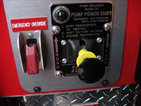 Disengage Pump Transmission Unlock (by squeezing) and slide the pump power shift lever from the lower -