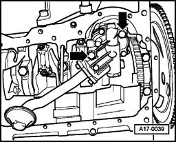 Page 26 of 33 17-21 Oil pump, removing and installing Removing - Remove oil pan Page 17-9. - Unhinge baffle plate and remove. - Remove bolts (arrows).