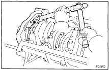 EG370 (b) Using a hammer and brass bar, remove the oil pump by carefully tapping the oil pump body. (c) Remove the 2 Orings from the cylinder block.