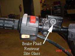 ¾ of site glass when the unit is setting on a level surface. Test the brakes by applying pressure to the brake lever and trying to push the unit forward.