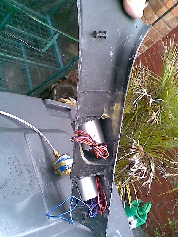 the sandwich plate with bungs in extra ports and oil temp sensor fitted and braided line.