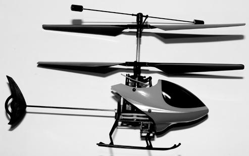 2) Upper Rotor Blades 3) Tail Boom 2. 4) LiPo Battery Compartment 5) Landing Skid 7.