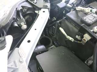 Remove the three grommets from the engine bay and store them on the