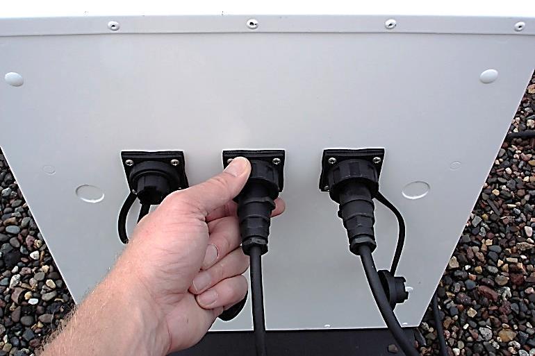16. Connect the other end of solar panel cables to the Solar Battery Enclosure as shown in Figure 18.