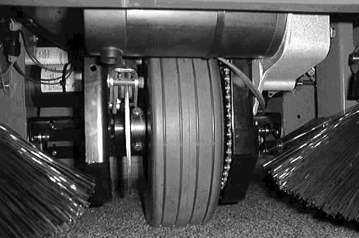 PROPELLING CHAIN (For machines below serial number 002363) The front wheel chain drive/support propels the front wheel to drive the machine.