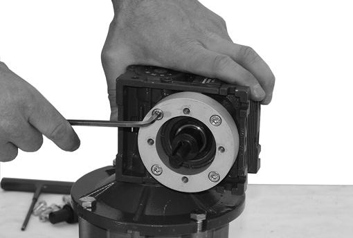 Loosen four () socket head screws (Figure, item ) and detach spacer (Figure, item ) from gear reducer (Figure, item ).