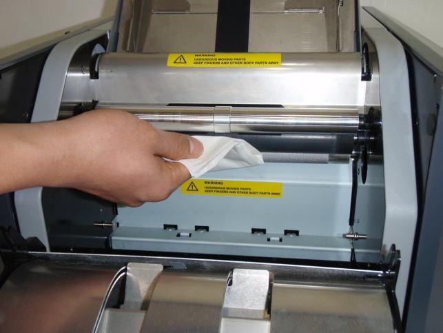 using a soft brush 2) Paper Dust With general use, paper dust will build up inside the machine and can be cleared