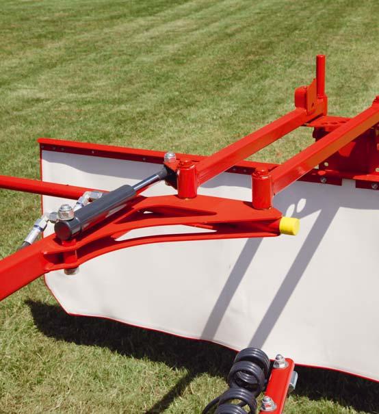KUHN PATENT A WINDROWING SYSTEM INTELLIGENT AND ADJUSTABLE FOR EVERYONE The windrow defl ector arm is mounted on a parallelogram