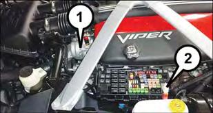 WHAT TO DO IN EMERGENCIES 5. Remove the plastic fuse cover to gain access to the remote jump-start positive (+) post in the engine compartment.