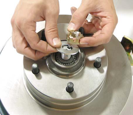 Slide the rotor onto the spindle being careful that the outer bearing does not fall out of place.