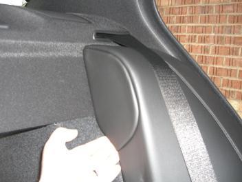 hand as shown. When the pillars come off, the retainer clip will still be attached to the car.