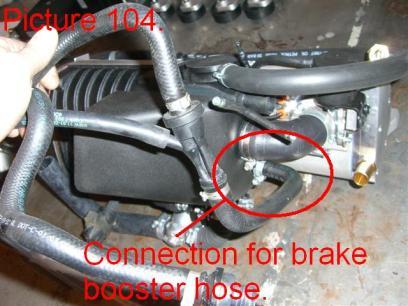 Locate and cut the hose clamp for the brake booster hose on the