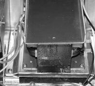 Remove the heat sink plate from the top of the high voltage microwave transformer. 10.