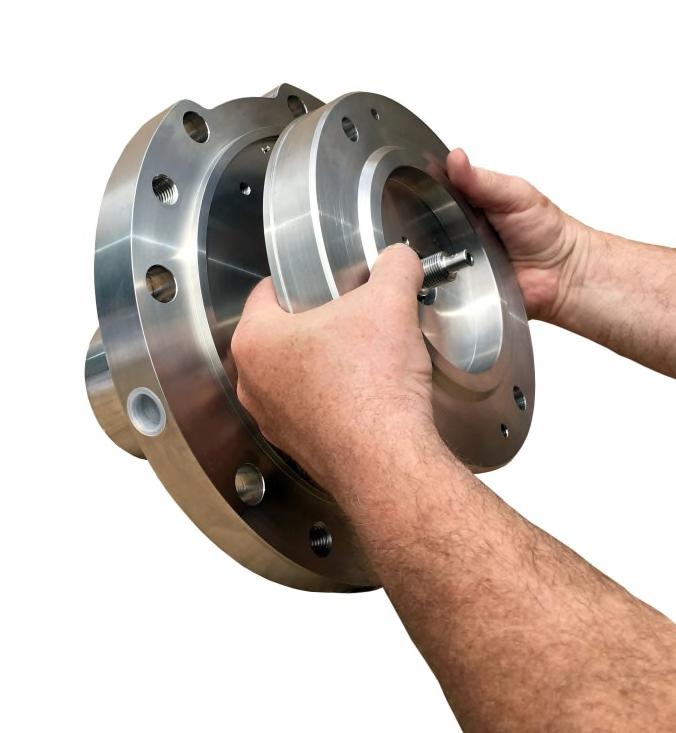 6. Thread a set bolt (Item 13) into the shaft flange from the impeller end and tighten. Lift the inner magnet assembly by the shaft and slowly slide it into the rear casing [Fig. 11].