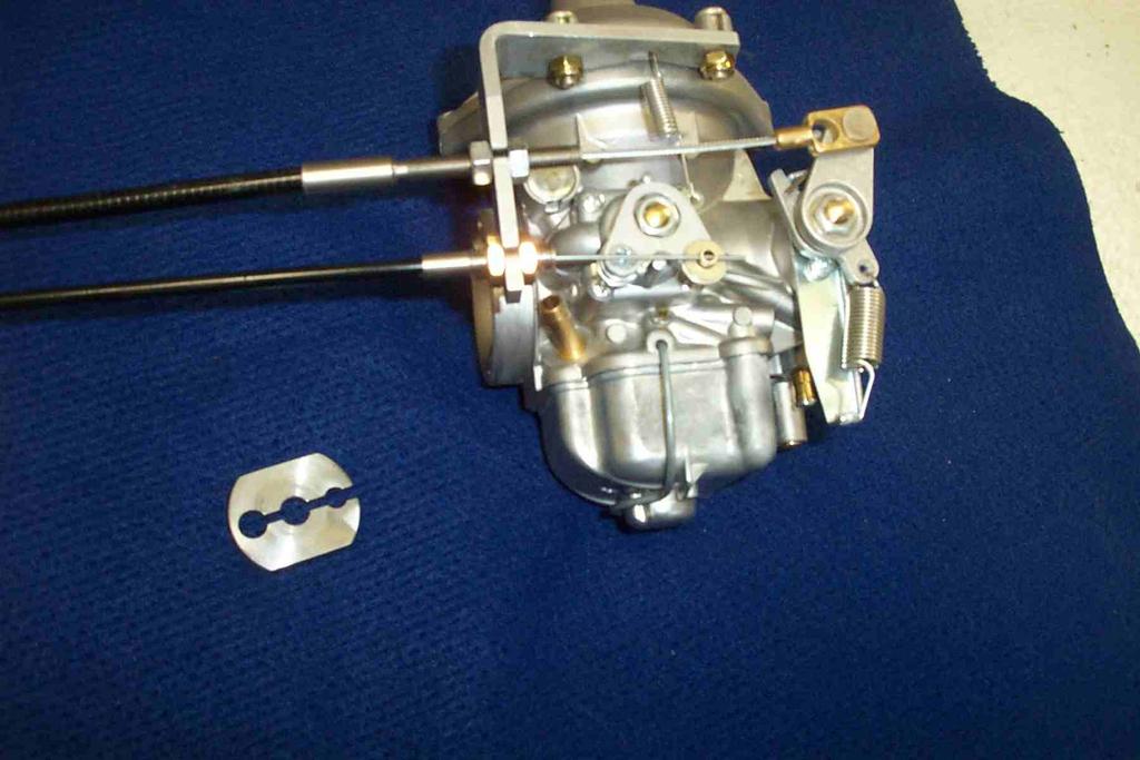 Provisions for the connection of the throttle and choke are made on the carburettor. Note: Since a pressure compensating carburettor is used there is no mixture control. Figure 6.