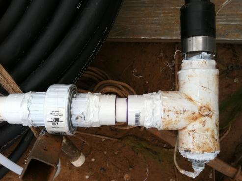 Figure 2-33. PVC Union Coil Connection Once the silicone on the leads dried, the coil could then be brought out to the testing location and dumped into the water.