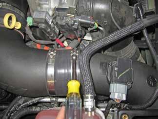 NOTE: The intake tube should pass under the stock MAF harness and small coolant return hose. o.